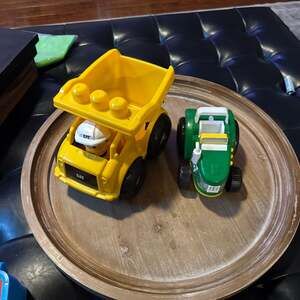 2 vehicles: Mega Bloks CAT Dump Truck and John Deere Tractor